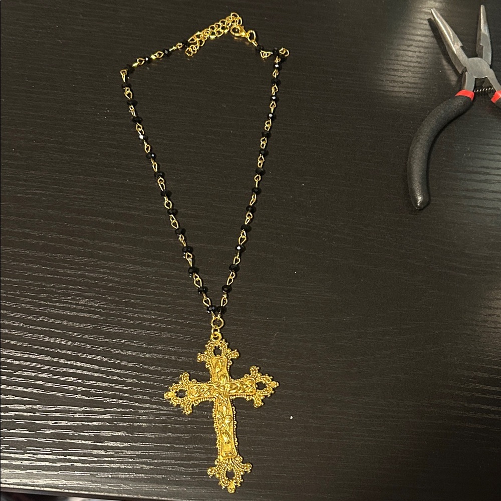 Ornate Gold Cross Necklace with Black Chain